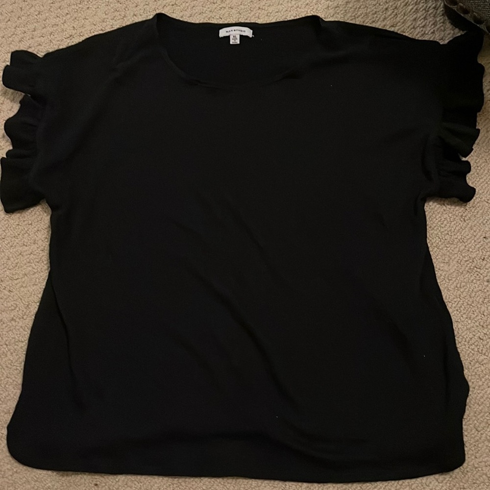Black top with ruffled sleeves